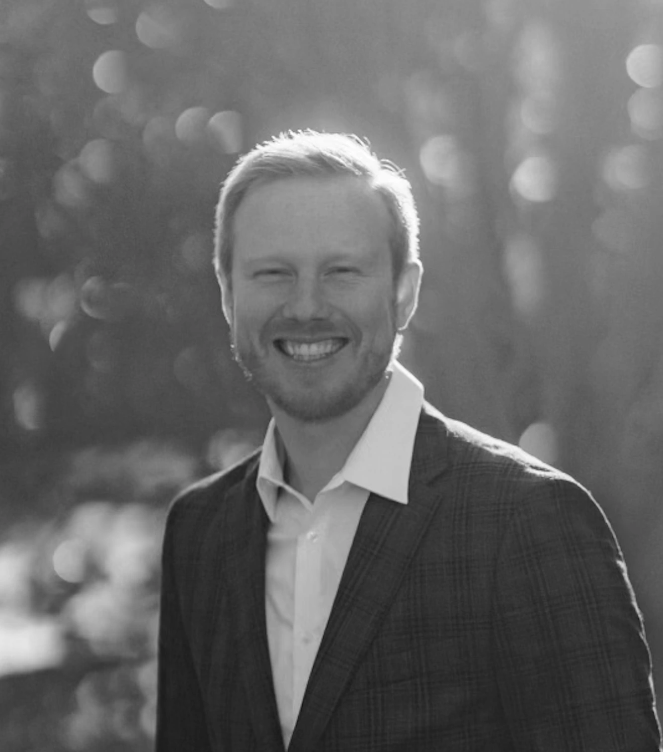 Black and white photo of Kyle, the officiant