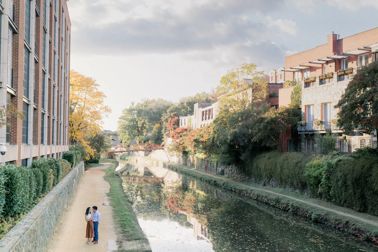 The couple walking along the Georgetown canal.
